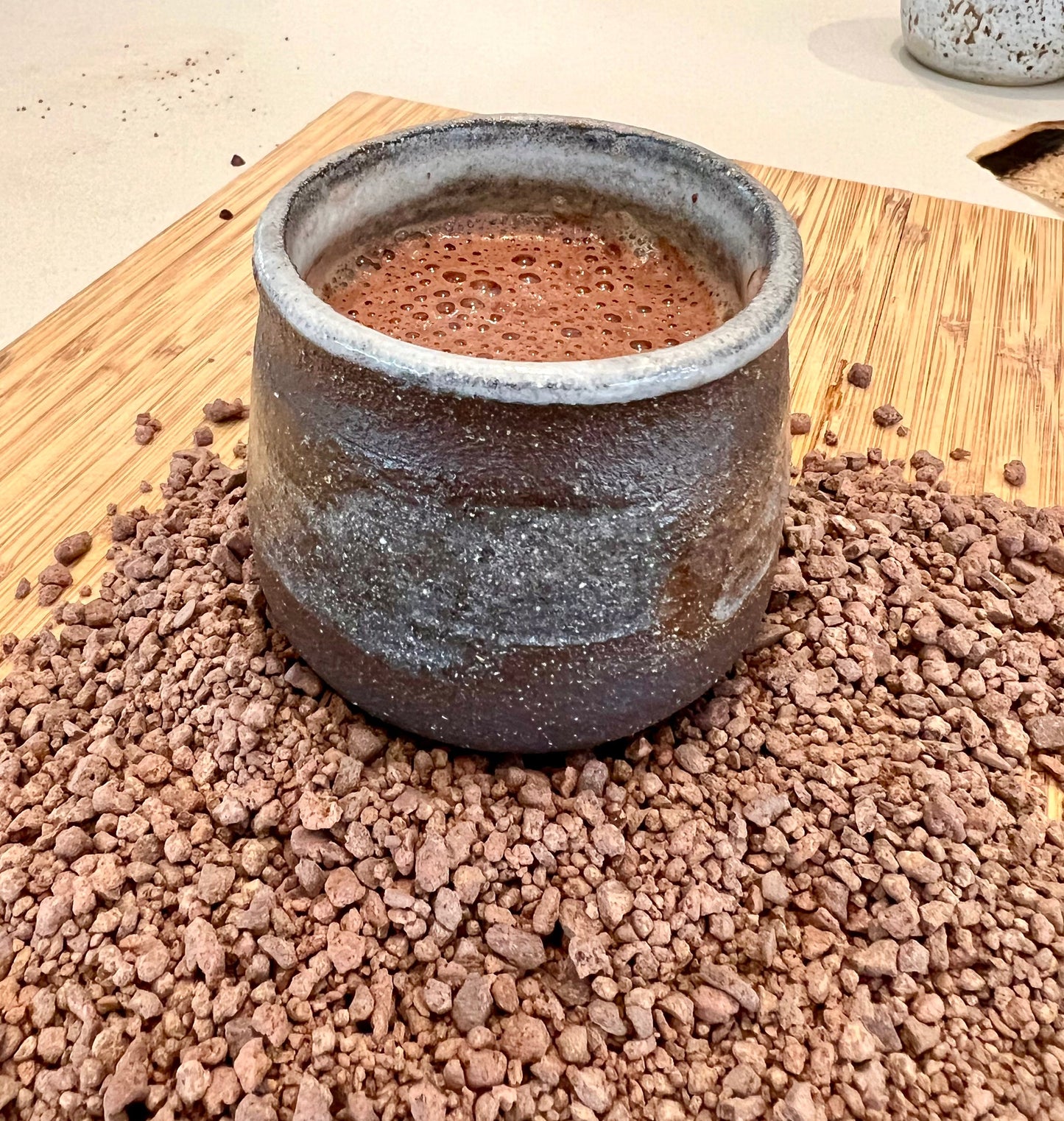 Close up of single-origin ceremonial cacao pebbles