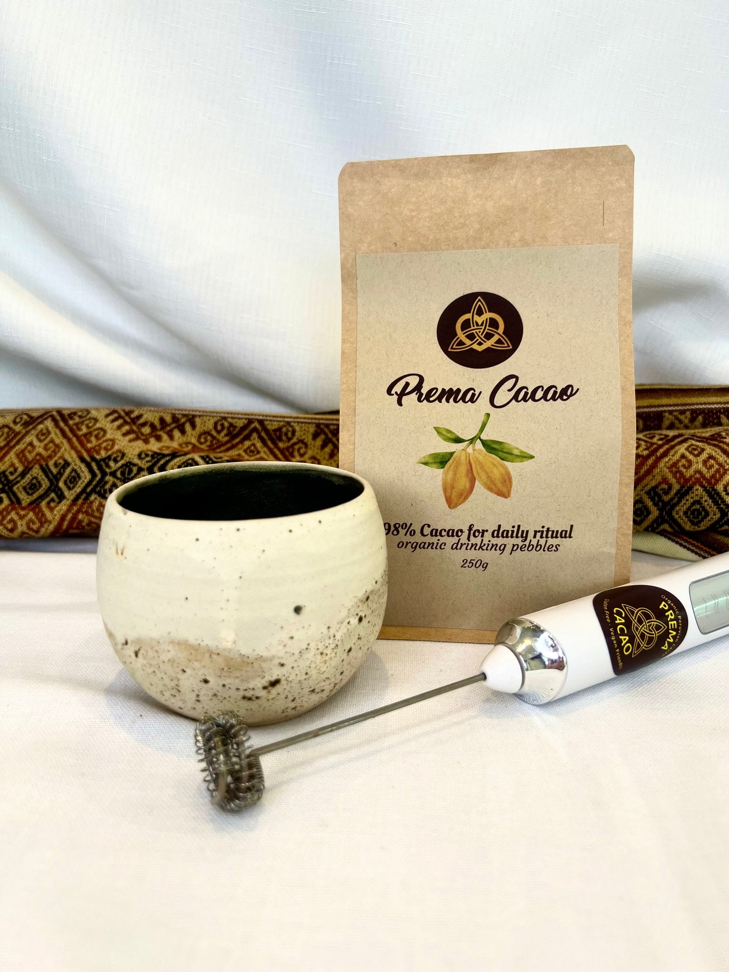 USB rechargeable cacao whisk frothing a cup of cacao
