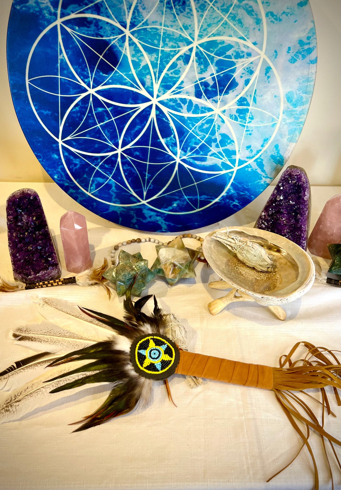 Handcrafted cleansing wand with four light feathers